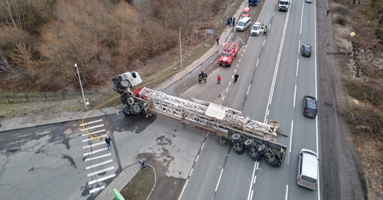 Aerial view of road accident with overturned semi truck