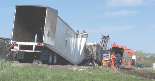 a tractor-trailer crash in a field
