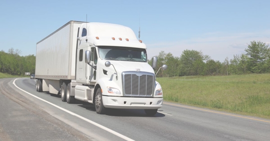 a truck driving down a highway