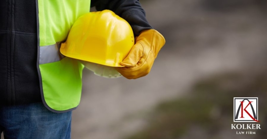 man holding a hard hat